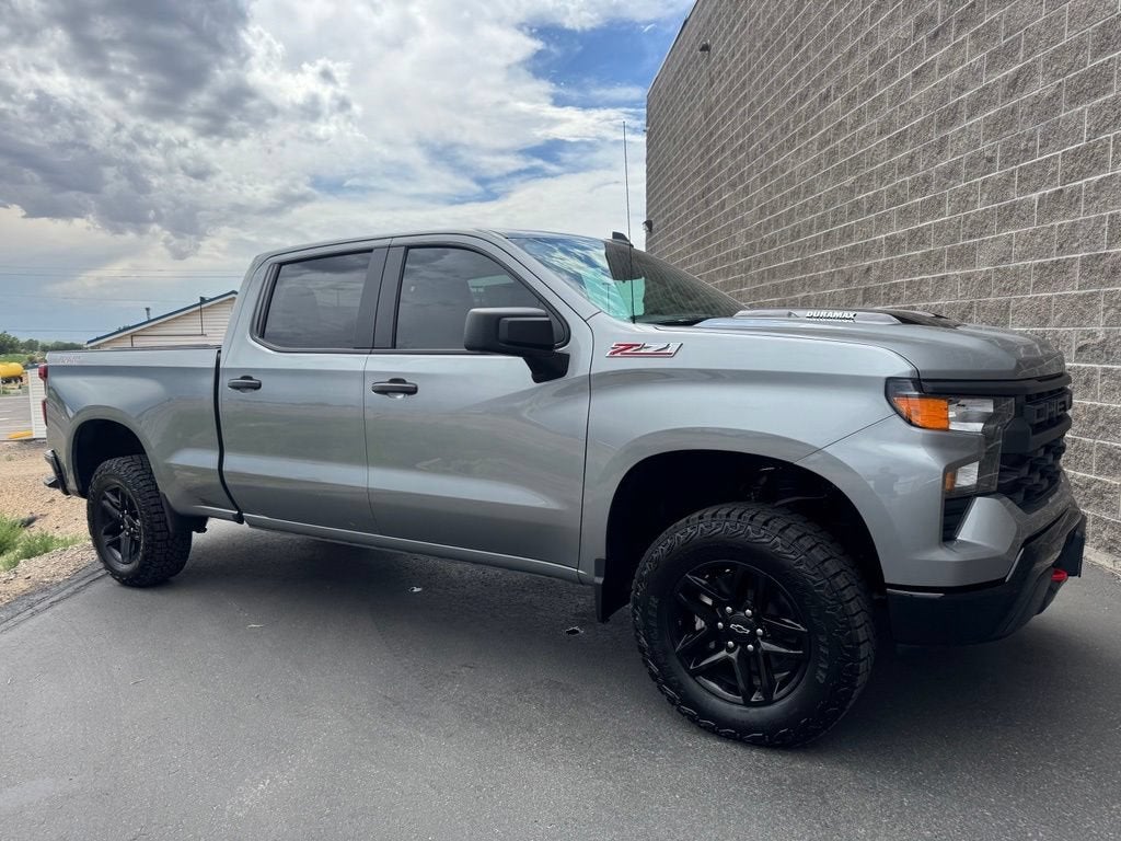 2026 Chevrolet Silverado 1500 Custom Trail Boss in Sterling Gray Metallic — front three-quarter view